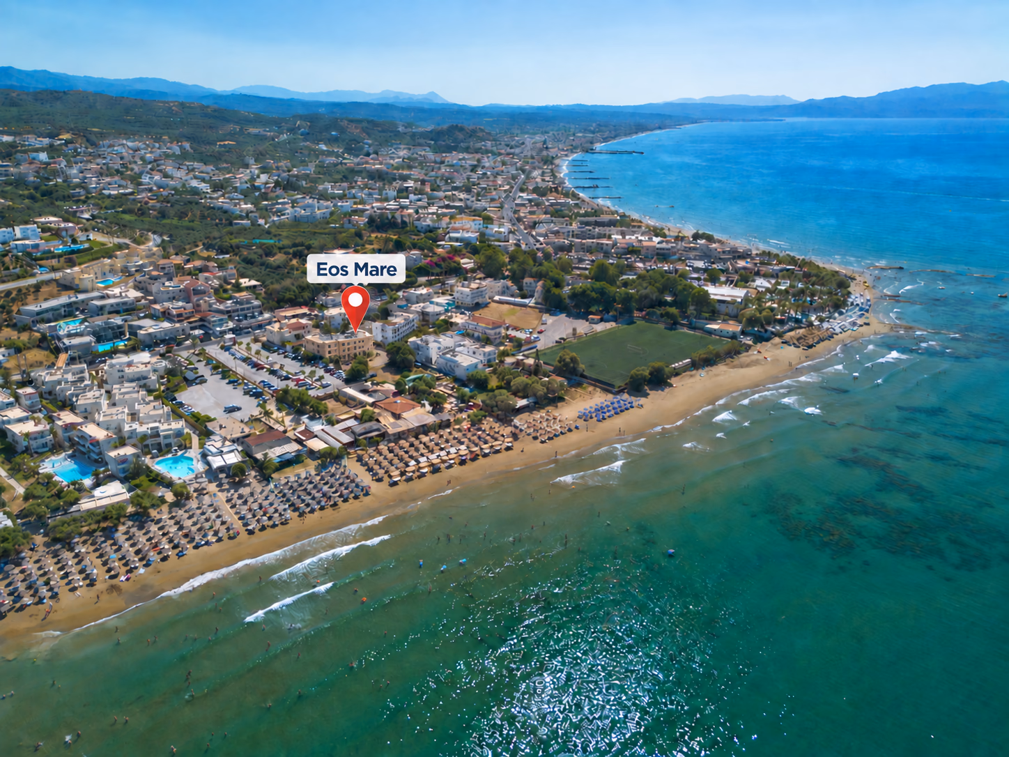 Aerial view of Agia Marina’s coastline in Chania, Crete, with Eos Mare marked