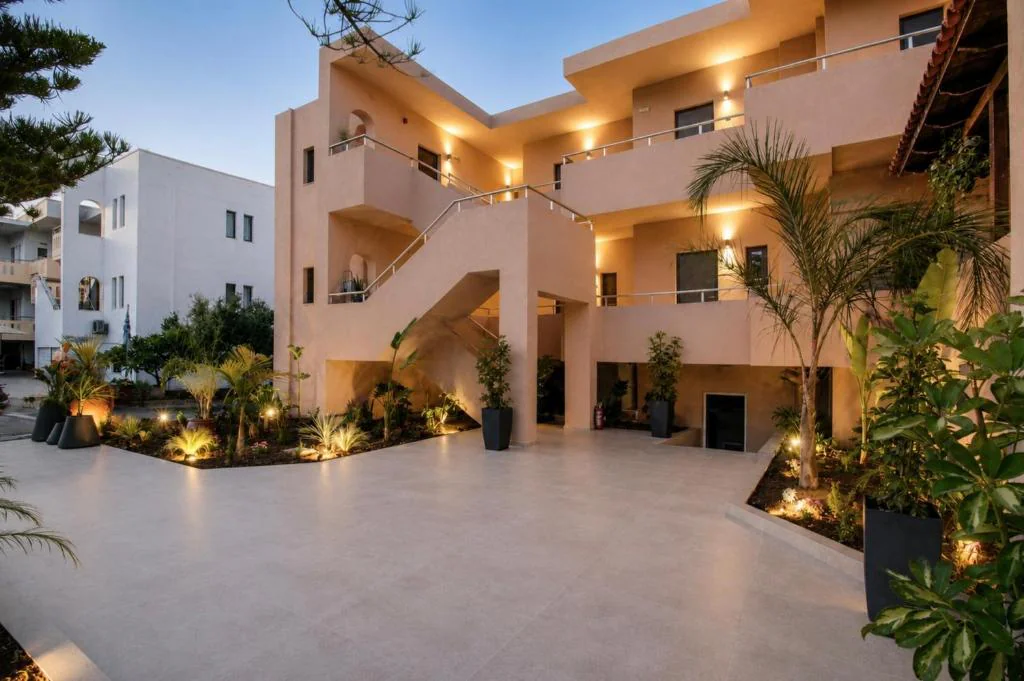 Eos Mare exterior and courtyard illuminated at dusk